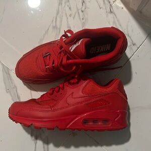 Red Nike iD tennis shoes